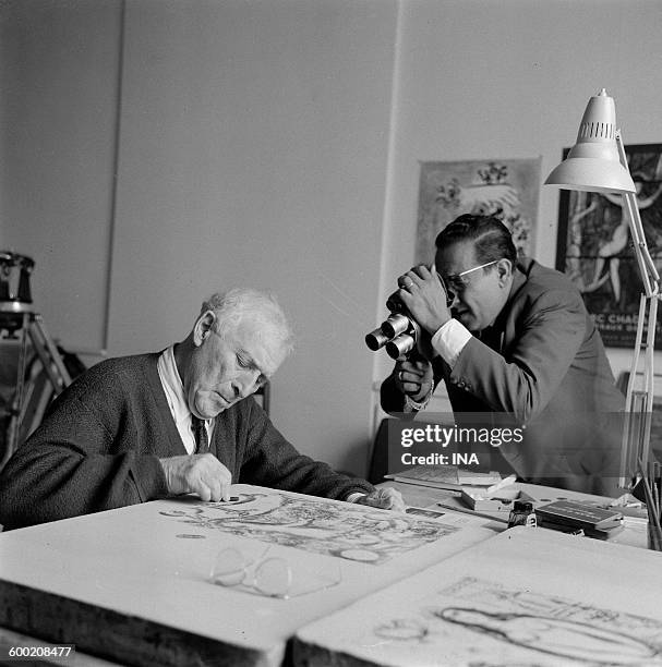 Marc Chagall in his Parisian workshop filmed by a reporter of the television news for the inauguration of the ceiling in the Garnier Opera.