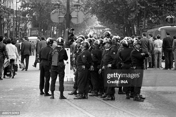 Police forces in situation in a street of Paris, during a demonstration in May, 68.