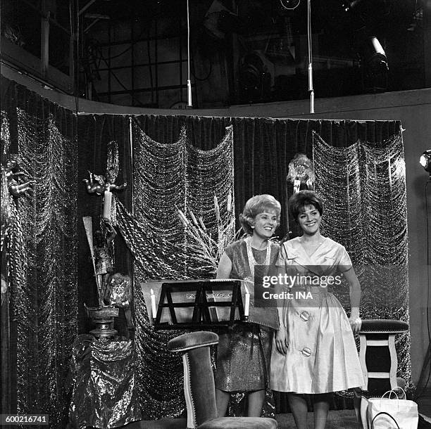 The announcers Catherine Langeais and Anne Marie Peysson on the set of a program during the Christmas time.