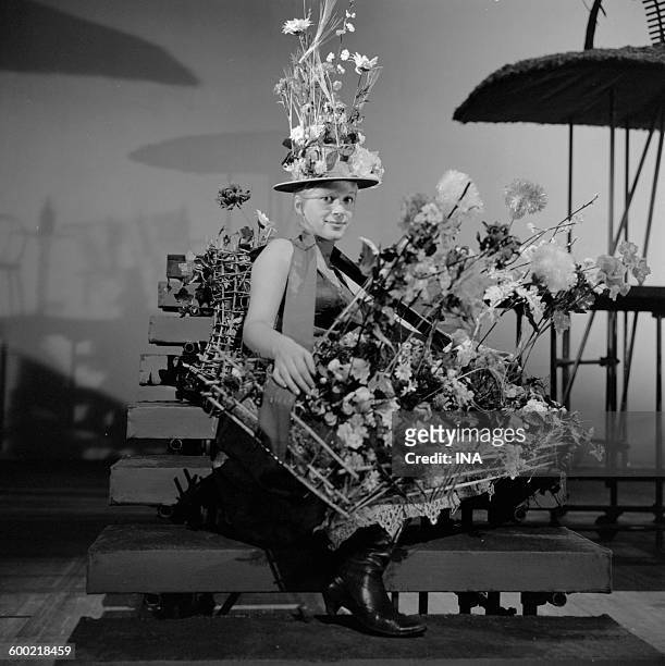 An actress playing in "The madwoman of Chaillot" Jean Giraudoux staged by Georges Wilson in the TNP rests in its costume during a rehearsal.