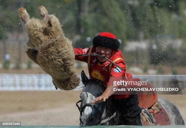Kyrgyz rider plays the traditional Central Asian sport Buzkashi also known as Kok-Boru or Oglak Tartis during the World Nomad Games 2016 in...