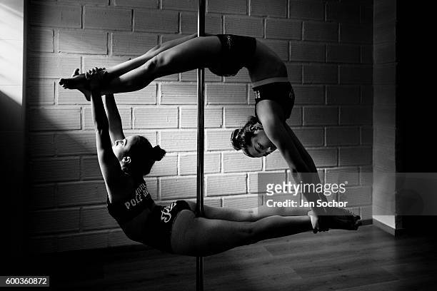 Valeria Aboultaif and Carolina Echavarria young Colombian pole dancers perform during a pole dance training session at Academia Pin Up on March 03,...
