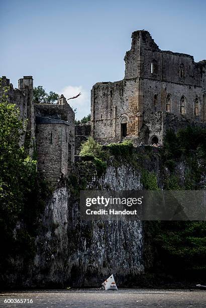 In this handout image provided by Red Bull, Blake Aldridge of the UK dives from 26 metres at Chepstow Castle while enroute to Pembrokeshire for the...