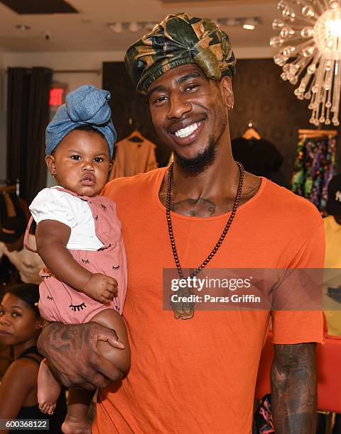 Iman Shumpert with his daughter Iman Tayla "Junie" Shumpert Jr. Baby Buddha Bug Collection Hosted By Teyana Taylor & Iman Shumpert at Pressed on...