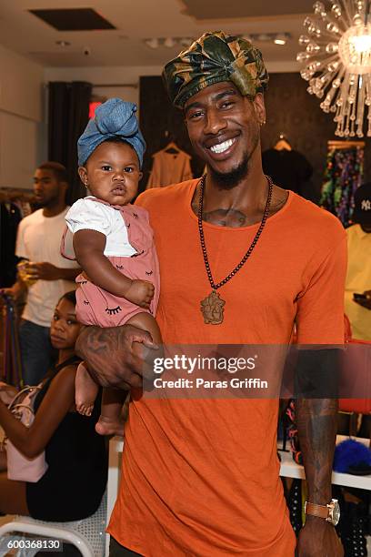 Iman Shumpert with his daughter Iman Tayla "Junie" Shumpert Jr. Baby Buddha Bug Collection Hosted By Teyana Taylor & Iman Shumpert at Pressed on...