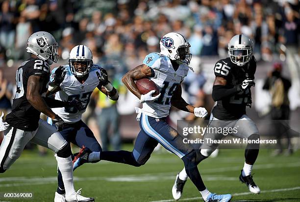 Wide receiver Tajae Sharpe of the Tennessee Titans runs with the ball after a catch against the Oakland Raiders in the first half of their preseason...