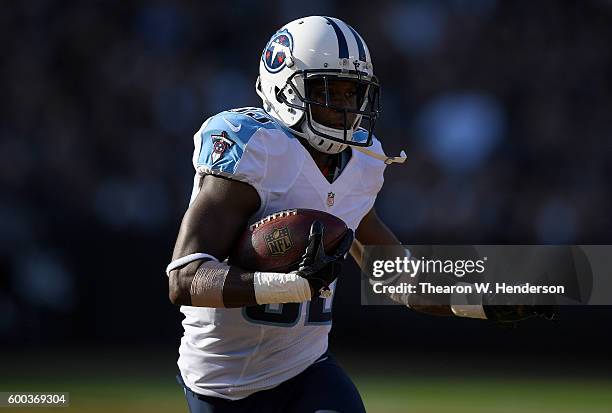 Wide receiver Harry Douglas of the Tennessee Titans runs with the ball against the Oakland Raiders in the first half of their preseason football game...