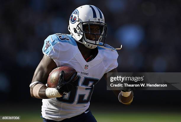 Wide receiver Harry Douglas of the Tennessee Titans runs with the ball against the Oakland Raiders in the first half of their preseason football game...