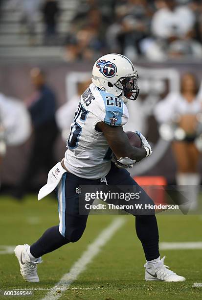 Running back Antonio Andrews of the Tennessee Titans carries the ball against the Oakland Raiders in the second half of their football game at the...