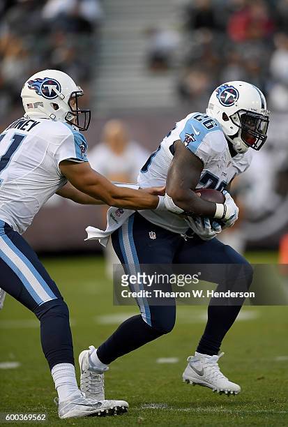 Running back Antonio Andrews of the Tennessee Titans carries the ball against the Oakland Raiders in the second half of their football game at the...