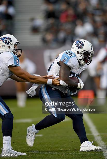Running back Antonio Andrews of the Tennessee Titans carries the ball against the Oakland Raiders in the second half of their football game at the...
