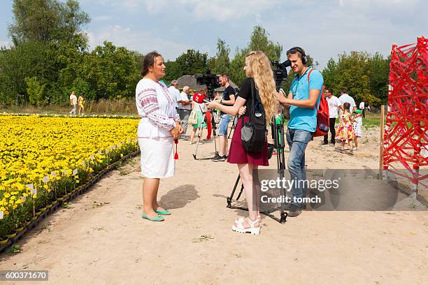 interview to ukrainian tv channels - worlds largest shooting fair stock pictures, royalty-free photos & images