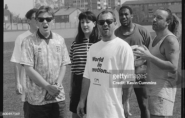 Members of of English rock group New Order with comedian Keith Allen and footballer John Barnes after they recorded the official song of the England...