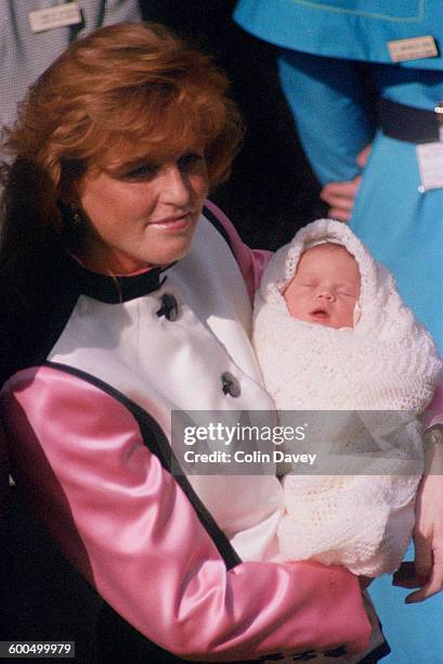 Sarah, Duchess of York leaves the Portland Hospital in London with her new daughter, Princess Eugenie, 30th March 1990.