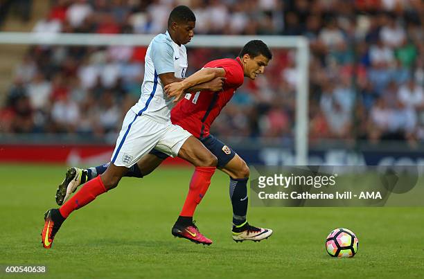 Marcus Rashford of England U21 and Mohamed Elyounoussi of Norway U21 during the UEFA European U21 Championship Qualifier Group 9 match between...