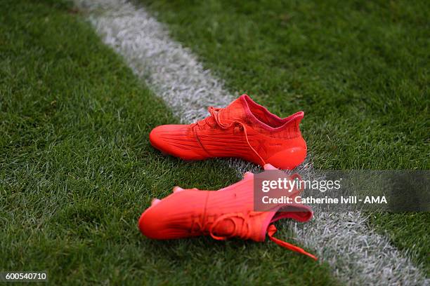 Pair of orange adidas boots lie on the pitch during the UEFA European U21 Championship Qualifier Group 9 match between England U21 and Norway U21 at...