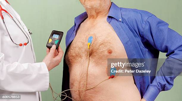 man with ecg electrodes - heartbeat foto e immagini stock