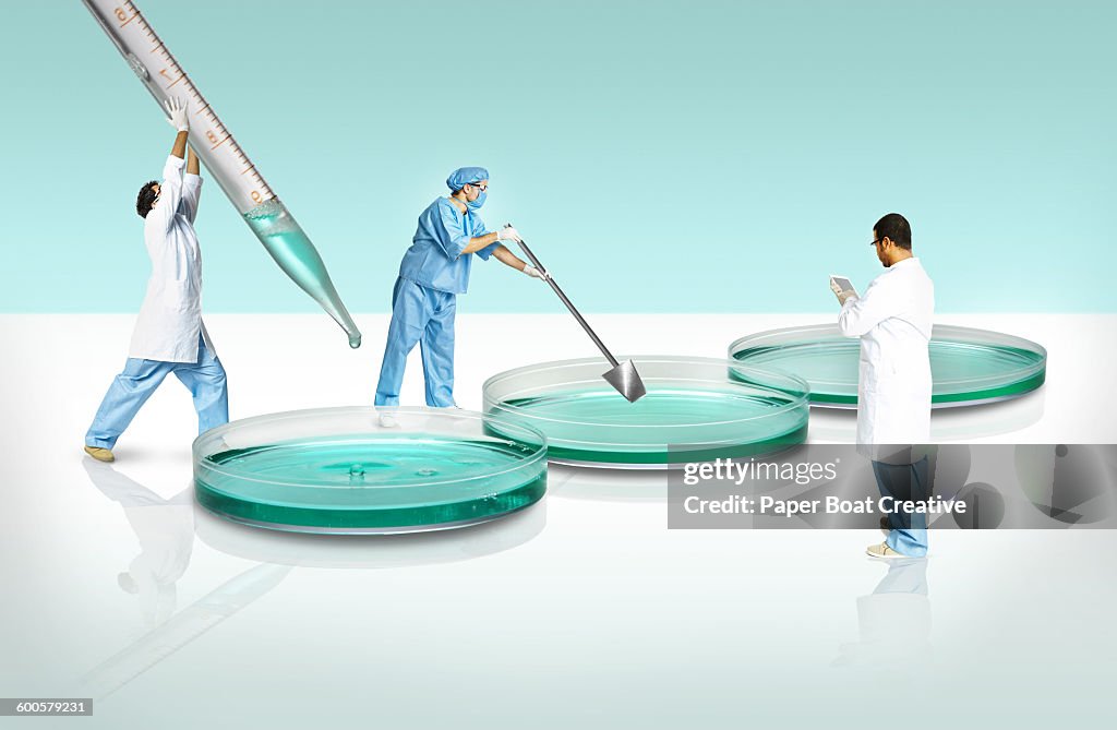 Group of scientists experimenting in a giant lab