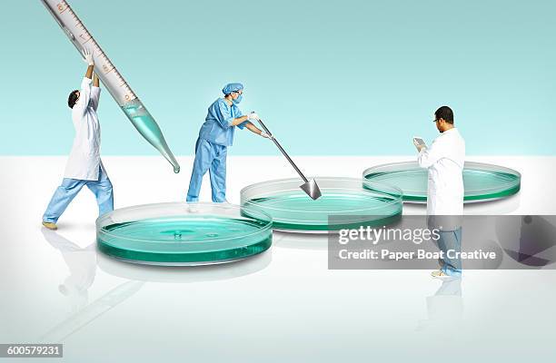 group of scientists experimenting in a giant lab - laboratory scale stock pictures, royalty-free photos & images