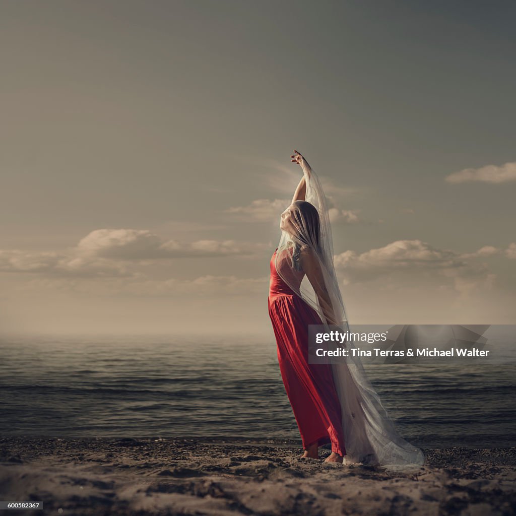 Woman standing on the beach