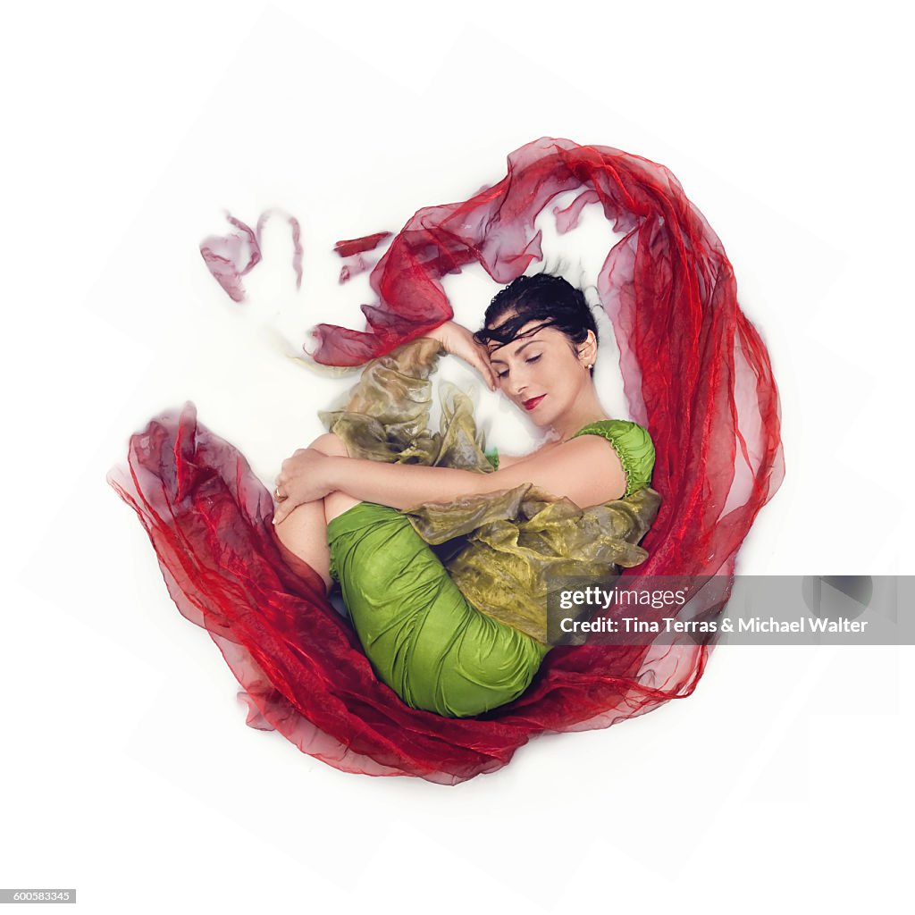 Woman lying on a white background