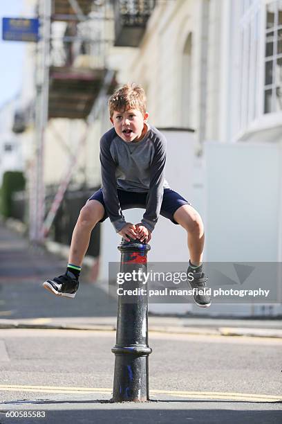 boy leapfrogging post - mansfield england stock pictures, royalty-free photos & images