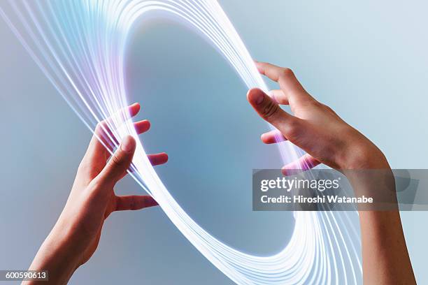 hand with light trails - imagination vision stockfoto's en -beelden