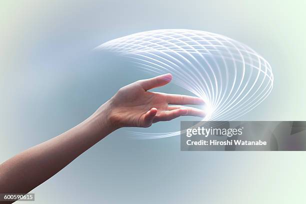 hand with light trails - light trail people stock pictures, royalty-free photos & images
