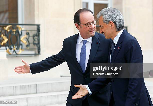 French President Francois Hollande welcomes Saudi Prince Alwaleed bin Talal bin Abdulaziz Al Saud before their meeting at the Elysee Presidential...