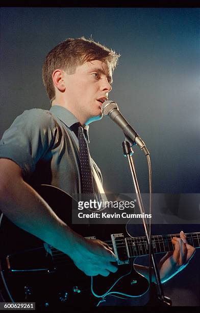 Singer and guitarist Bernard Sumner performing with English rock group New Order, at Comanche Student Union, Manchester Polytechnic, 6th February...