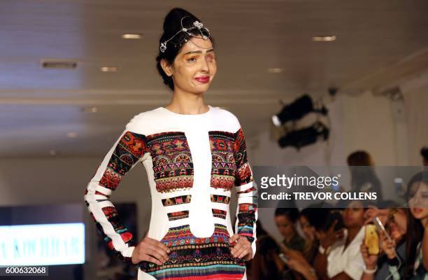 Acid attack survivor Reshma Bano of India walks the runway during the FTL Moda presentation at New York Fashion Week in New York, on September 8,...