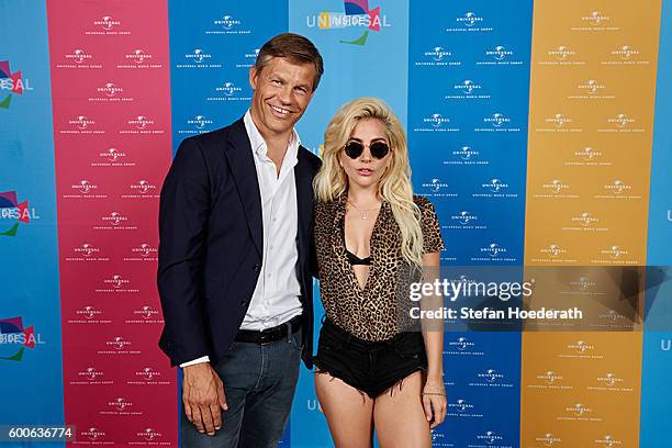 Frank Briegmann of Universal Music and musician Lady Gaga pose for a photo during Universal Inside 2016 organized by Universal Music Group at...