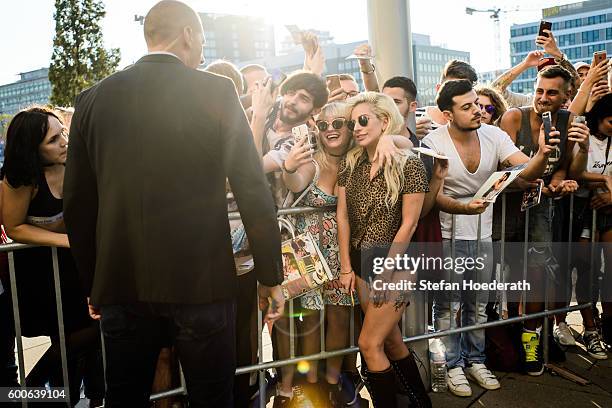 Musician Lady Gaga poses for a photo with fans during Universal Inside 2016 organized by Universal Music Group at Mercedes-Benz Arena on September 8,...