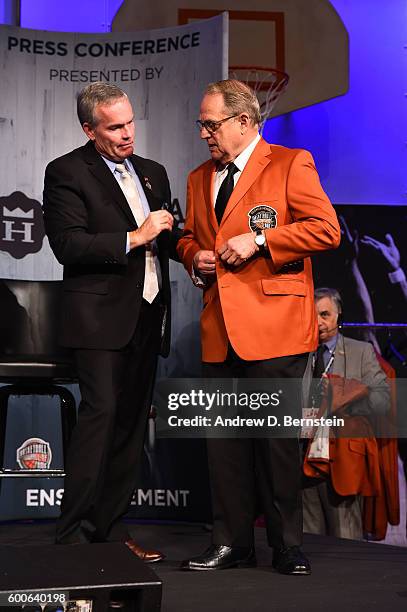 John Doleva, President and CEO of the Basketball Hall of Fame presents the Official Jacket to Jerry Reinsdorf of the Chicago Bulls during the Class...