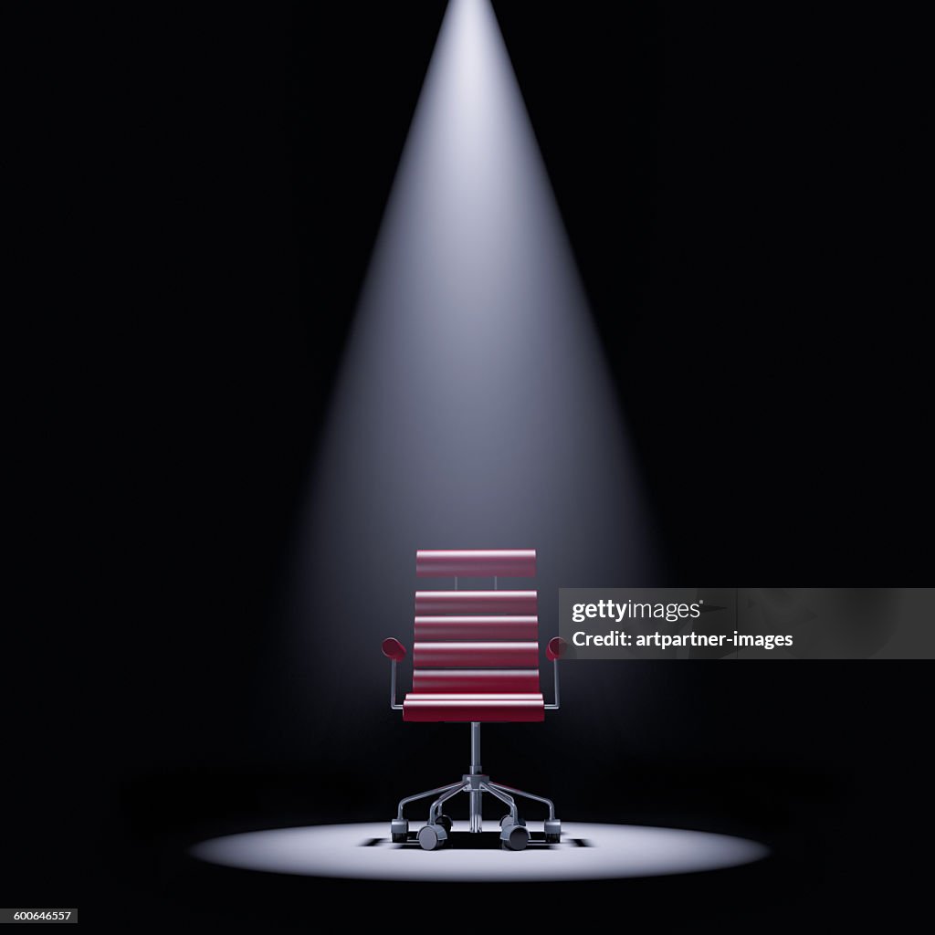 Office chair in a spotlight
