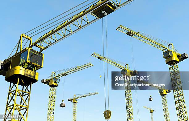 cranes at work, blue sky - heidelberg project stock pictures, royalty-free photos & images