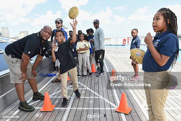 At an event to promote literacy on board the Carnival Triumph while it is docked at the Port of New Orleans, former New Orleans Saints running back...
