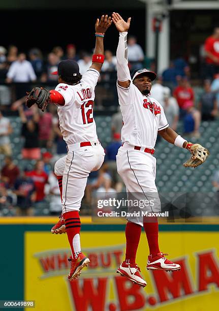 Francisco Lindor of the Cleveland Indians celebrates with Rajai Davis after defeating the Houston Astros at Progressive Field on September 8, 2016 in...