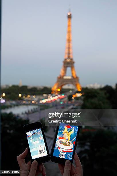 Tourist plays Nintendo Co.'s Pokemon Go augmented-reality game at the Trocadero in front of the Eiffel tower on September 8, 2016 in Paris, France....