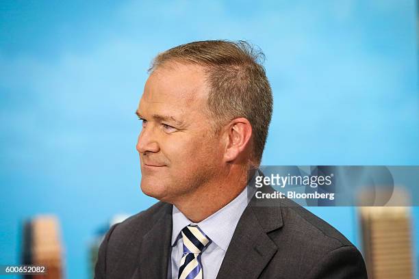 Charlie Young, president and chief executive officer of Coldwell Banker Real Estate, listens during a Bloomberg Television interview in New York,...