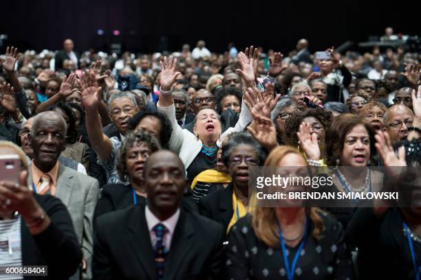 People sing before an appearance by Democratic presidential nominee Hillary Clinton at the 136th Annual Session of the National Baptist Convention at...