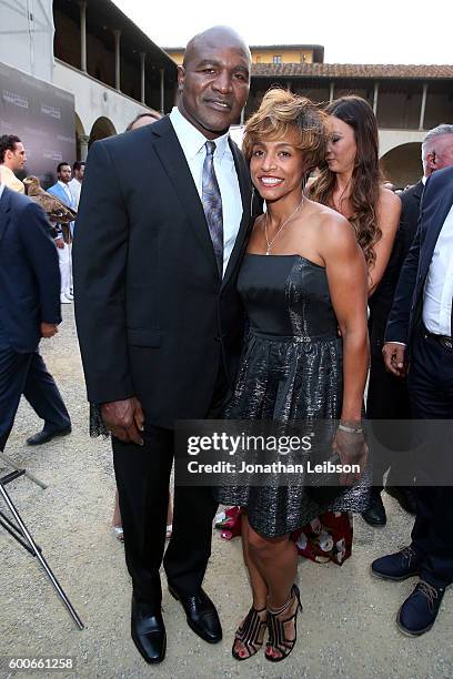 Evander Holyfield and Shevon Harris attend the Basilica di Santa Croce Dinner and Reception as part of Celebrity Fight Night Italy benefitting the...