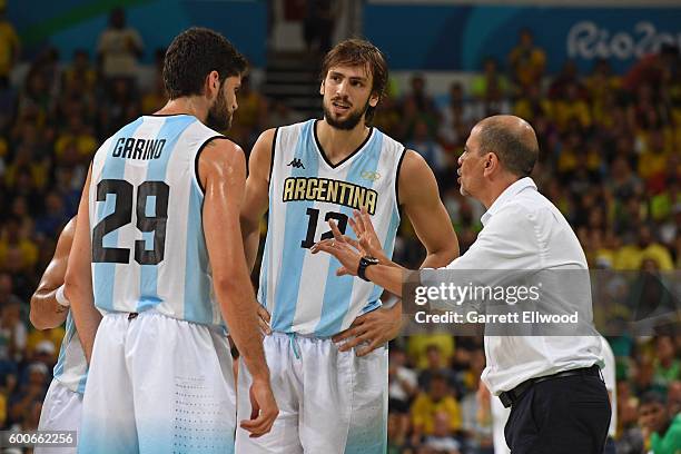 Patricio Garino, Marcos Nicolas Delia and head coach Sergio Hernandez of Argentina talk during the game against Brazil on Day 8 of the Rio 2016...