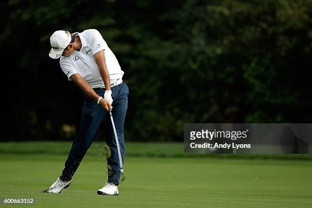 Hideki Matsuyama of Japan hits his second shot on the fourth hole during the first round of the BMW Championship at Crooked Stick Golf Club on...