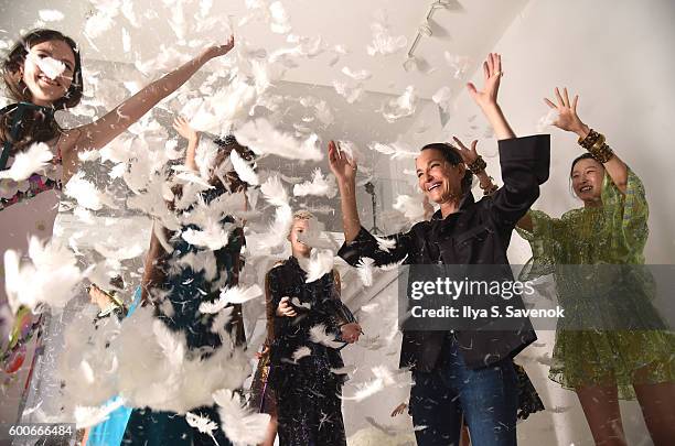 Designer Cynthia Rowley plays with feathers and models at Cynthia Rowley - Presentation during New York Fashion Week: The Shows on September 8, 2016...