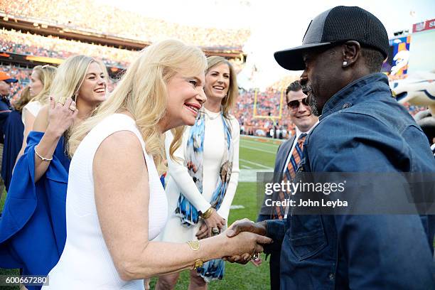 Annabel Bowlen shakes hands with Oscar-nominated actor and Denver East High School graduate Don Cheadle before the first quarter. The Denver Broncos...