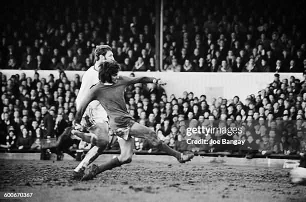Manchester United player George Best scores during a match against Northampton Town, UK, 7th February 1970.