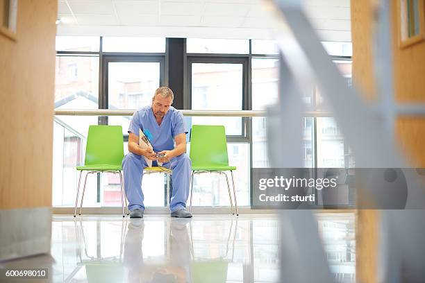doctor in contemplation - ethical treatment stock pictures, royalty-free photos & images