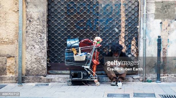homeless man asking for money at the street - homeless stock pictures, royalty-free photos & images