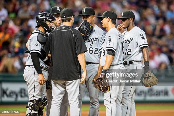 Manager Robin Ventura of the Chicago White Sox talks with starting pitcher Jose Quintana and the rest of his infielders during the fourth inning...